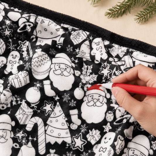 Illustrative coloring scene: adding red to a Santa hat on the Christmas blanket