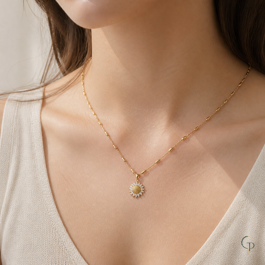 Small sunflower pendant station chain necklace worn below the collarbones