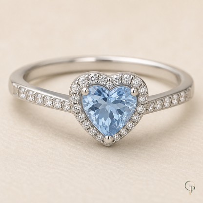 Close view of the pale blue heart center, clear halo and pavé-style shoulders