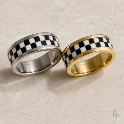 Close view of silver-color and gold-color checkerboard ring bands with polished edge rails