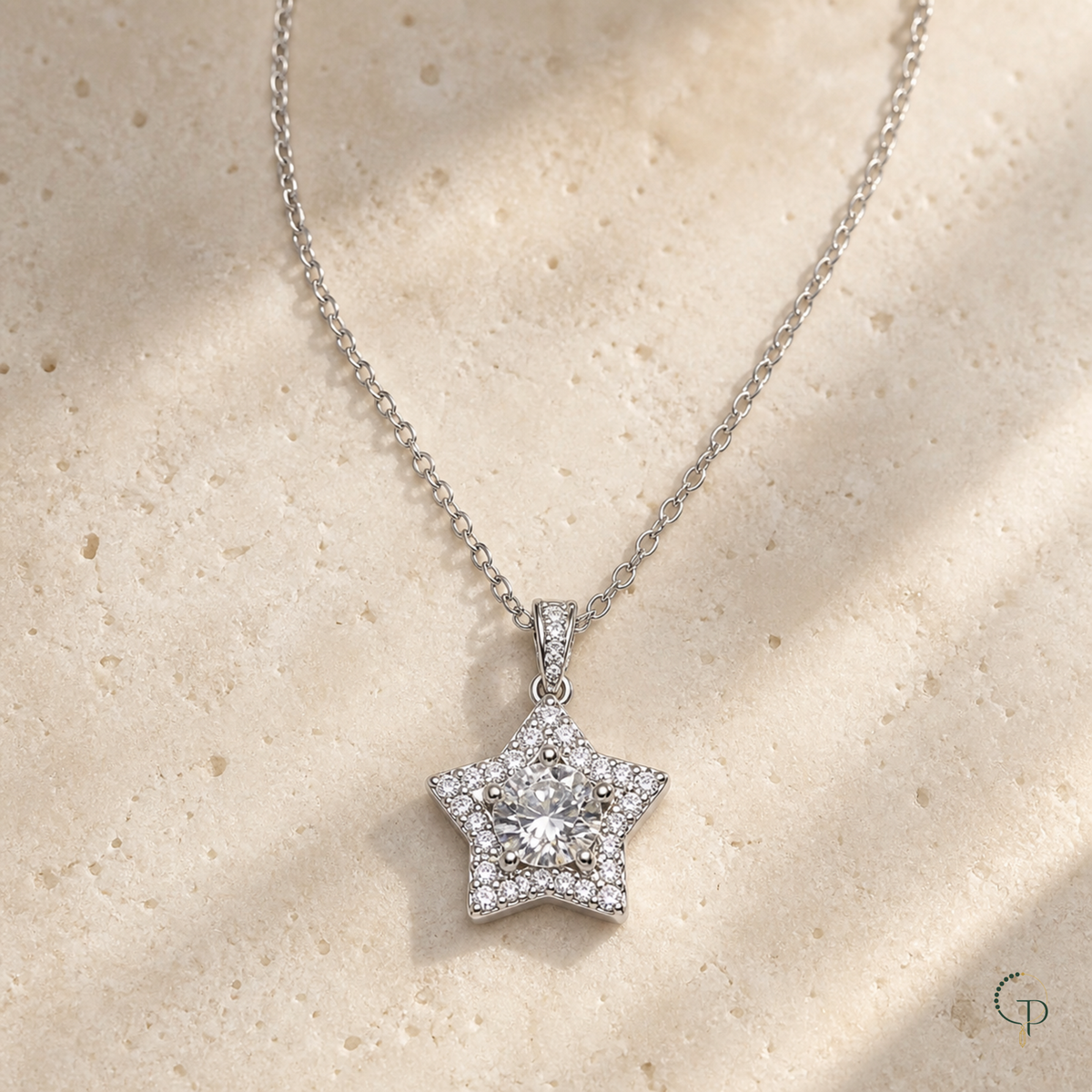 Clear center star pendant necklace on warm ivory stone with Gemmy Pocket logo