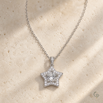 Clear center star pendant necklace on warm ivory stone with Gemmy Pocket logo