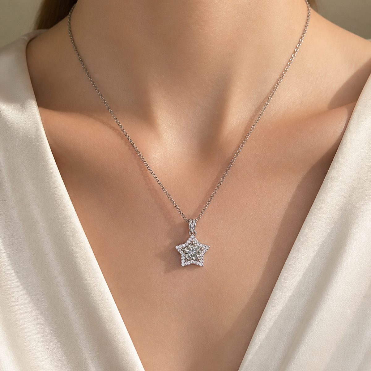 Clear center star pendant necklace worn with an ivory V-neck blouse