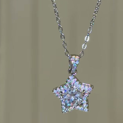 Source-video close view of five-point star pendant and clear center stone