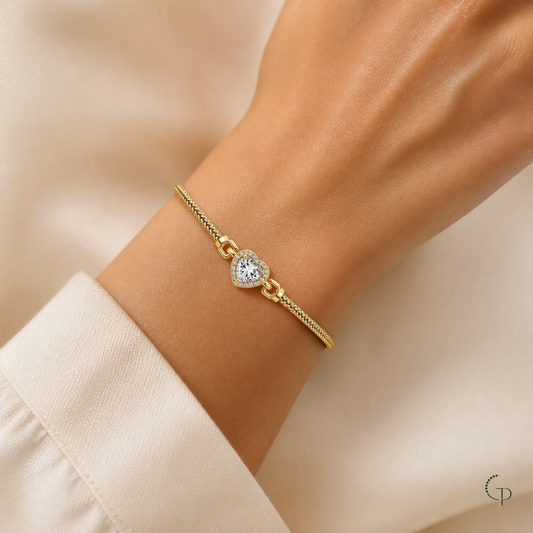Gold-color heart halo bracelet worn on an anonymous wrist