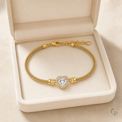 Clear-stone heart halo bracelet displayed in an unbranded ivory box