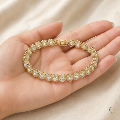 Clear-stone heart-link bracelet displayed on an anonymous hand for scale