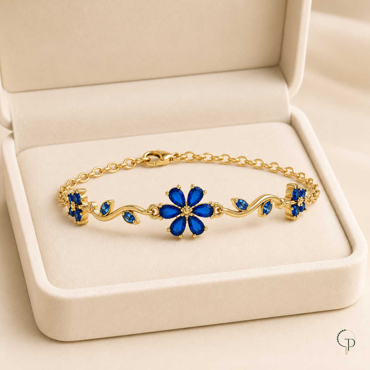 Cobalt blue floral vine bracelet displayed in an unbranded ivory jewelry box