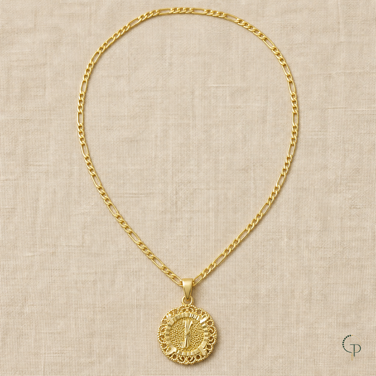 Full gold-color long-short link necklace arranged on oatmeal linen