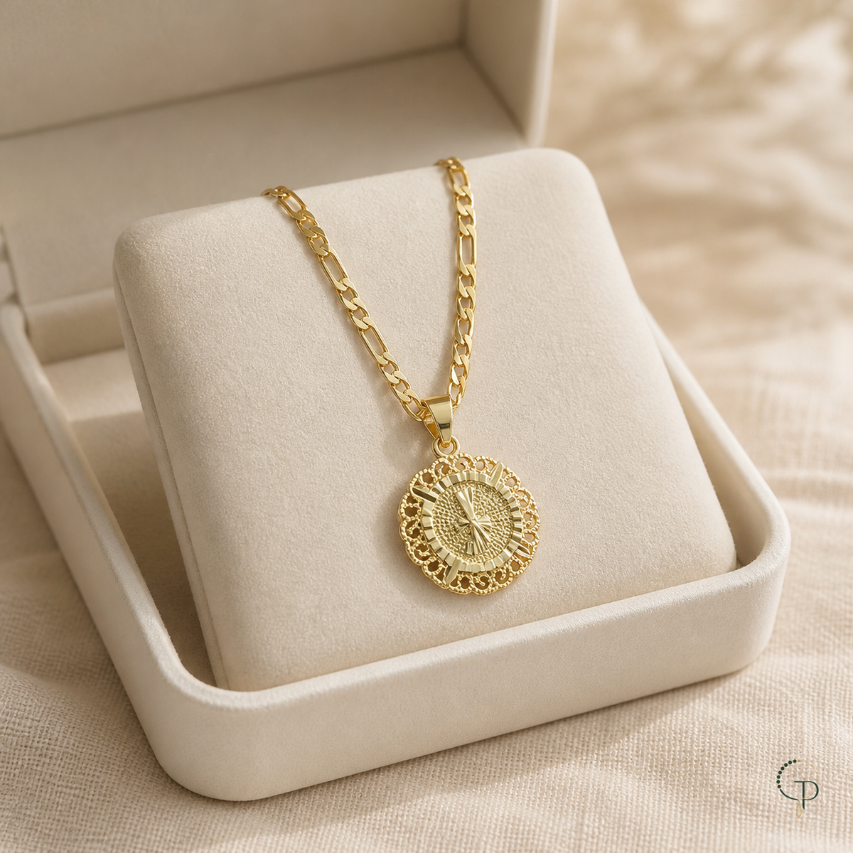 Gold-color round medallion necklace styled in an unbranded ivory display box