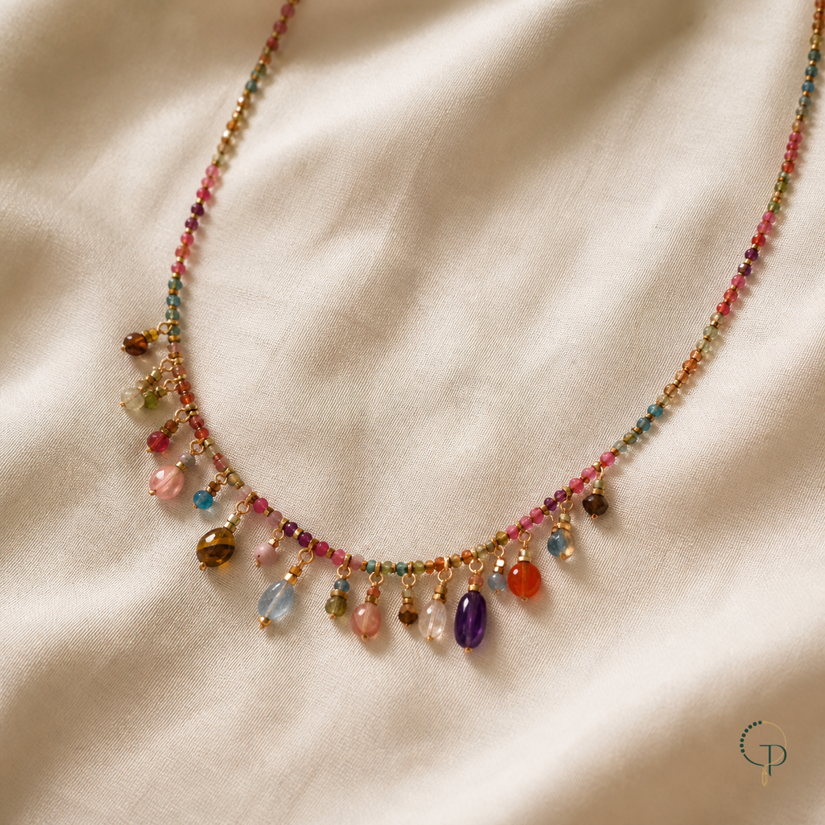 Multicolor beaded charm necklace on warm ivory linen | PureNoi