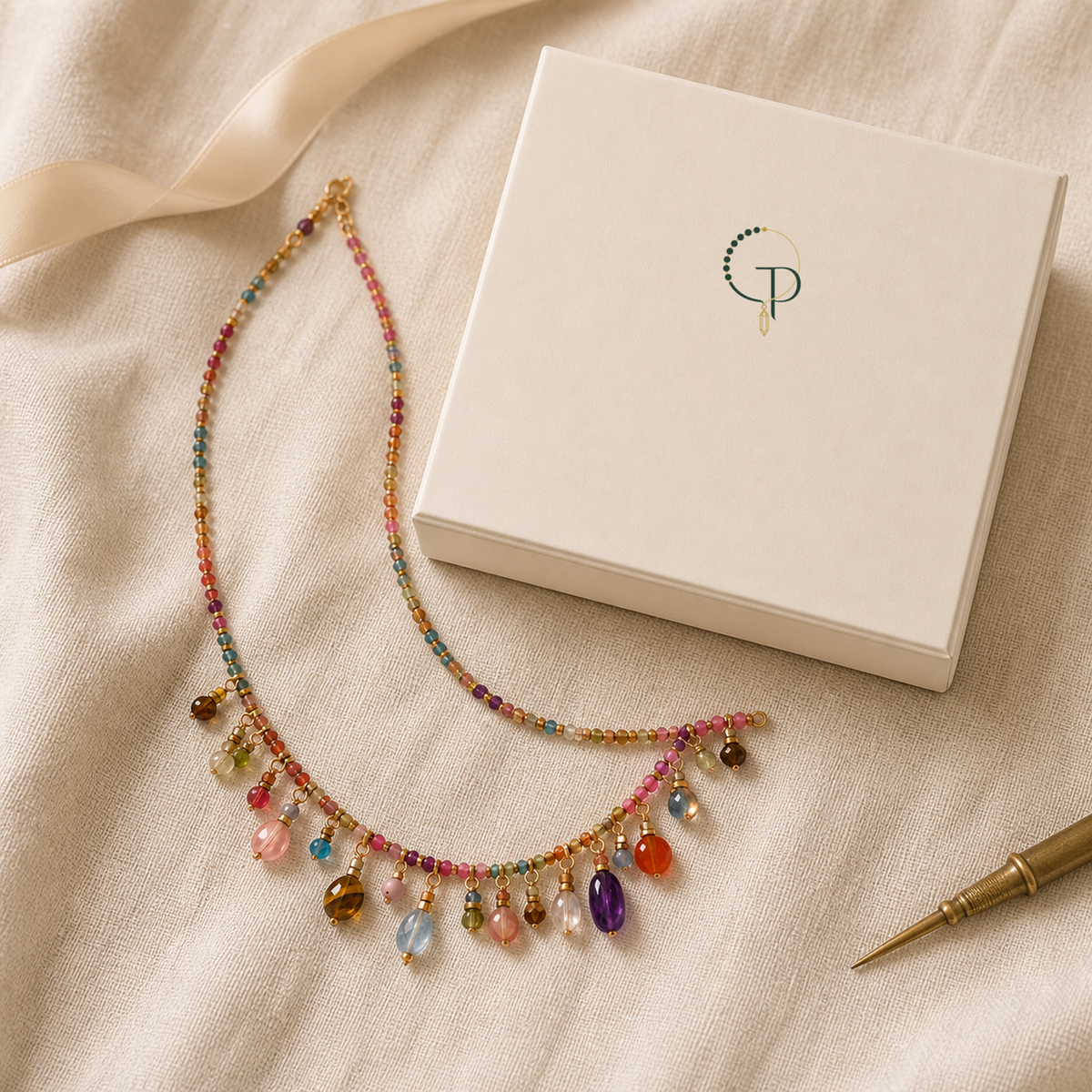 Multicolor beaded charm necklace beside an ivory PureNoi jewelry box