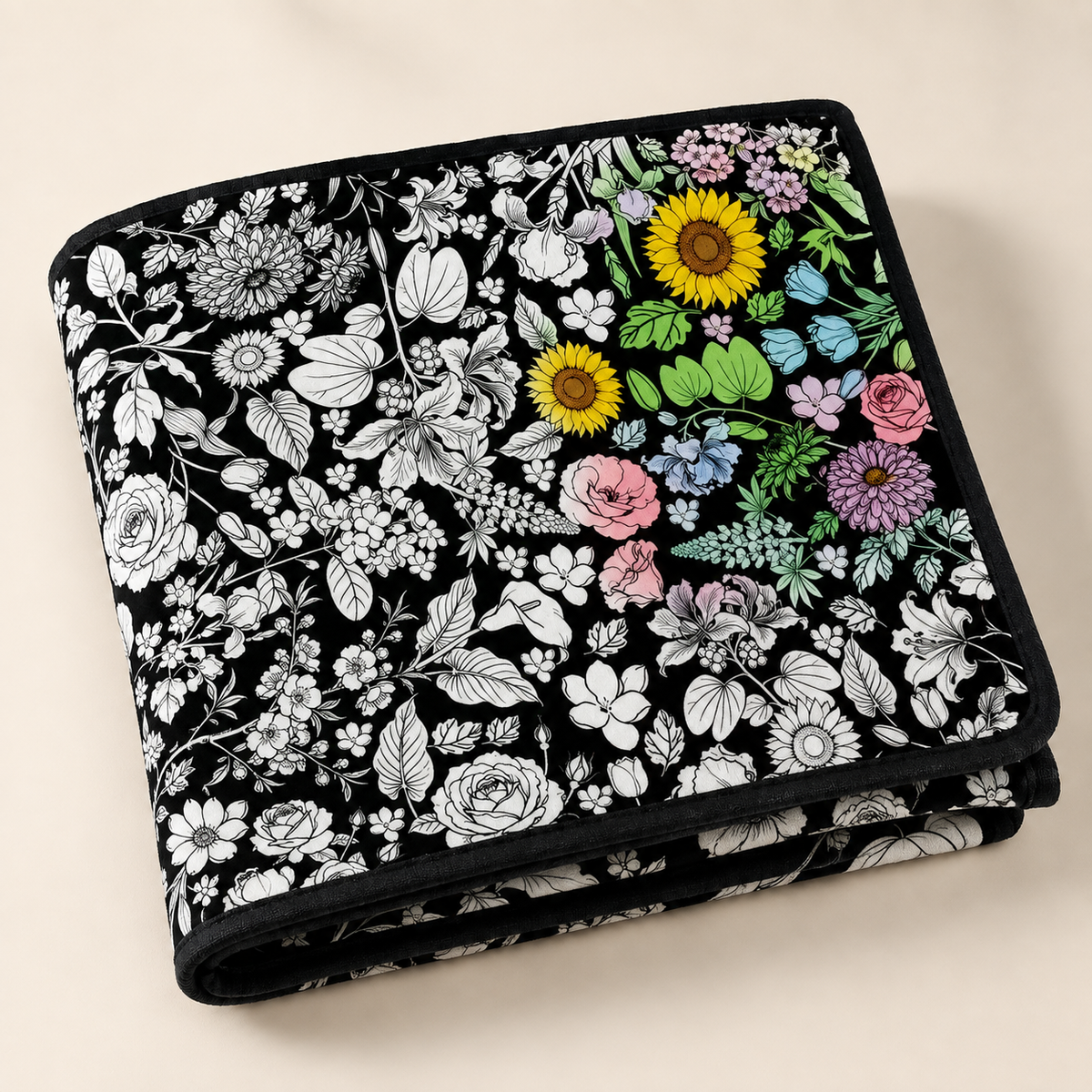 Folded botanical coloring blanket with black edging