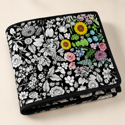 Folded botanical coloring blanket with black edging