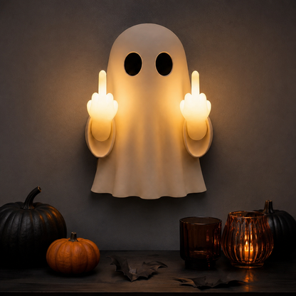Ghost wall light styled with pumpkins and amber glass for Halloween