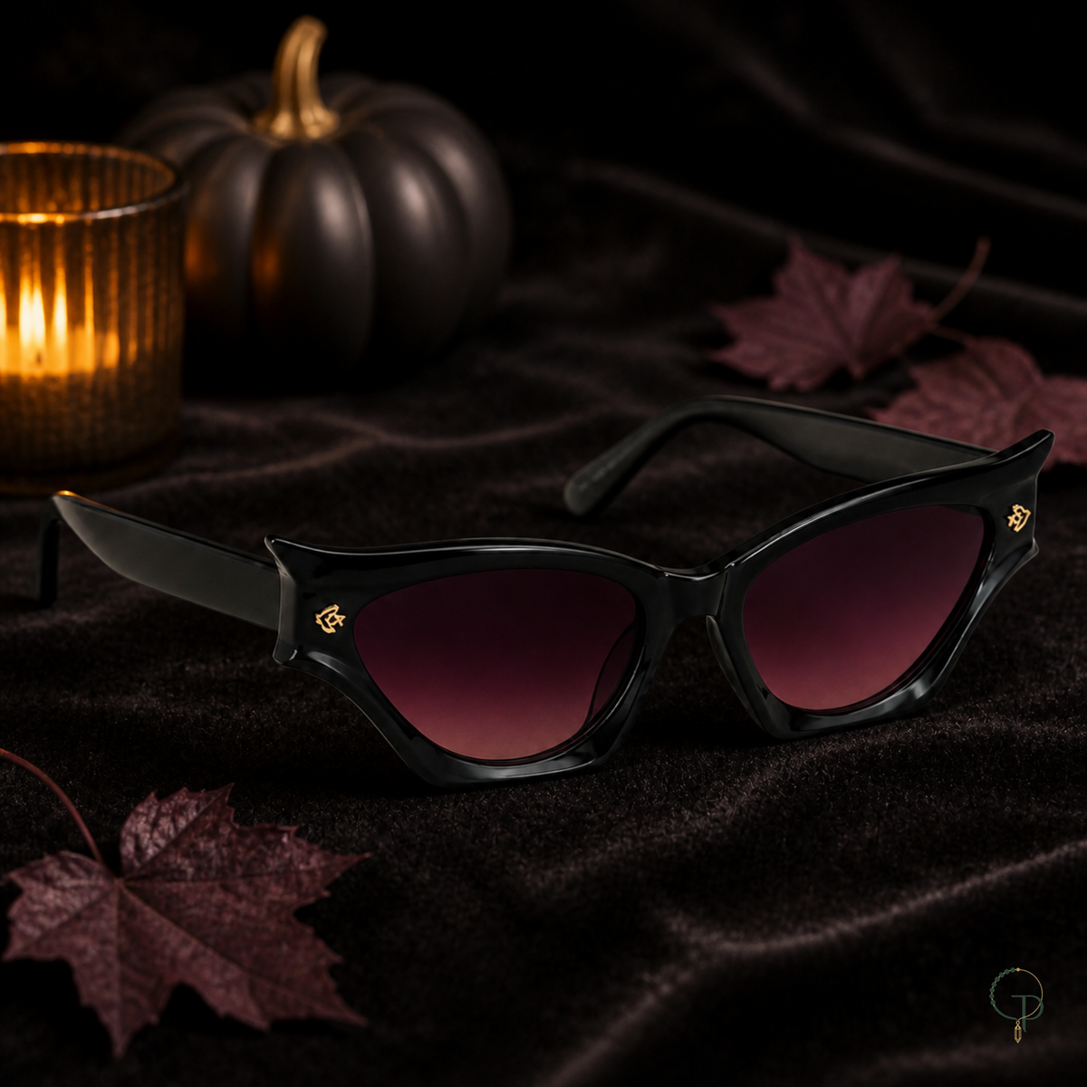 Three-quarter view of Halloween black cat-eye sunglasses with dark velvet and candlelight
