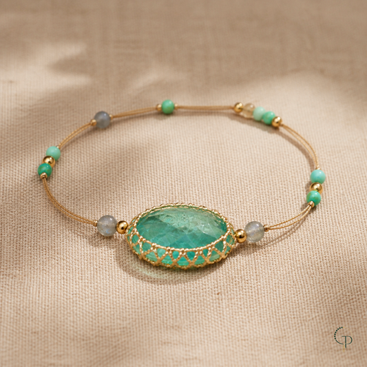 Oval aqua stone braided cord bracelet on warm oatmeal linen