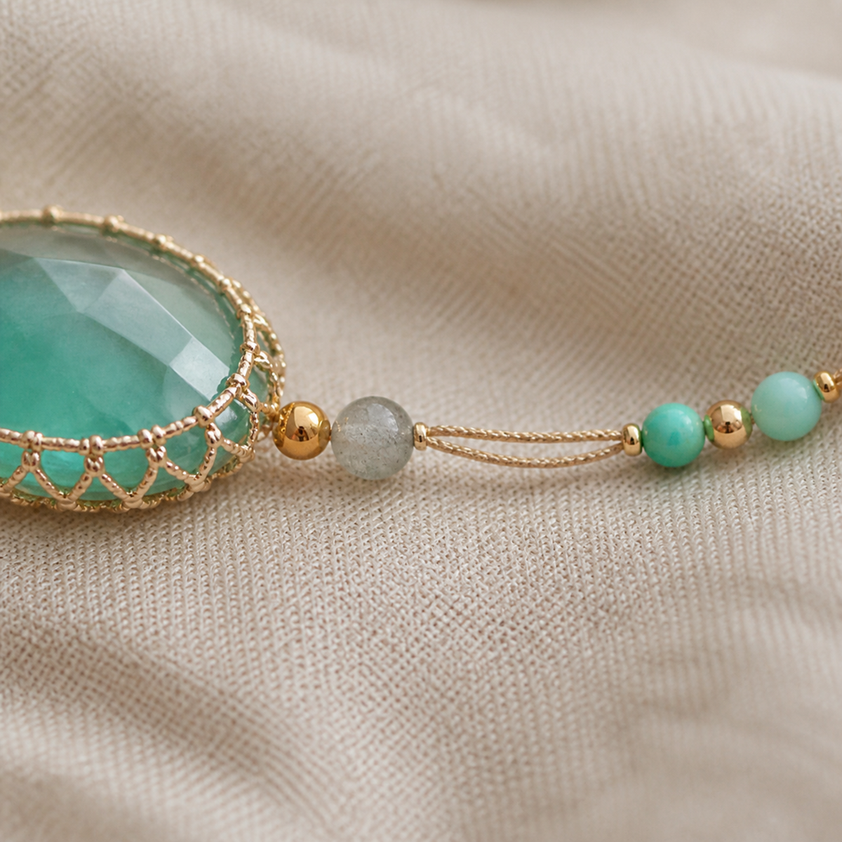 Detail of the braided cord with turquoise grey and gold-color beads