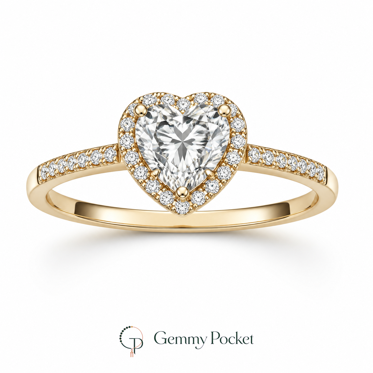 Gold-color heart halo ring with clear center stone on a white studio background