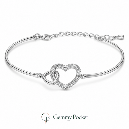 Silver-color interlocking double-heart bracelet on a seamless white studio background