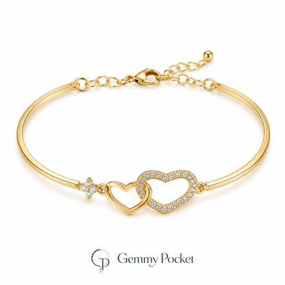 Gold-color bracelet with smooth and clear pavé-style interlocking hearts on white