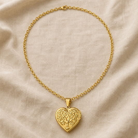 Golden tree of life heart locket necklace on warm ivory linen