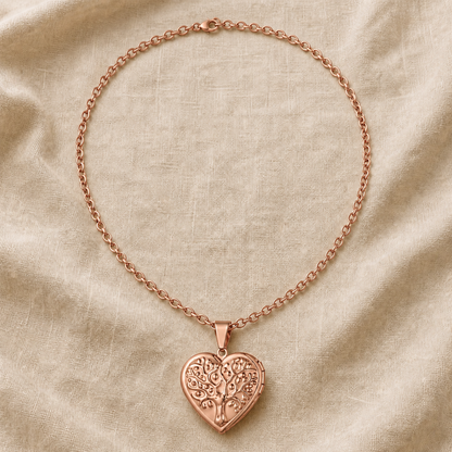 Copper tree of life heart locket necklace on warm ivory linen