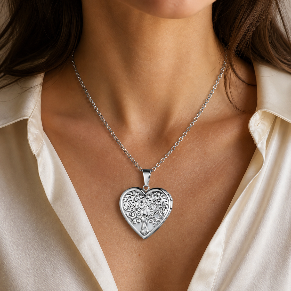 Silver heart locket necklace worn alone with an ivory top