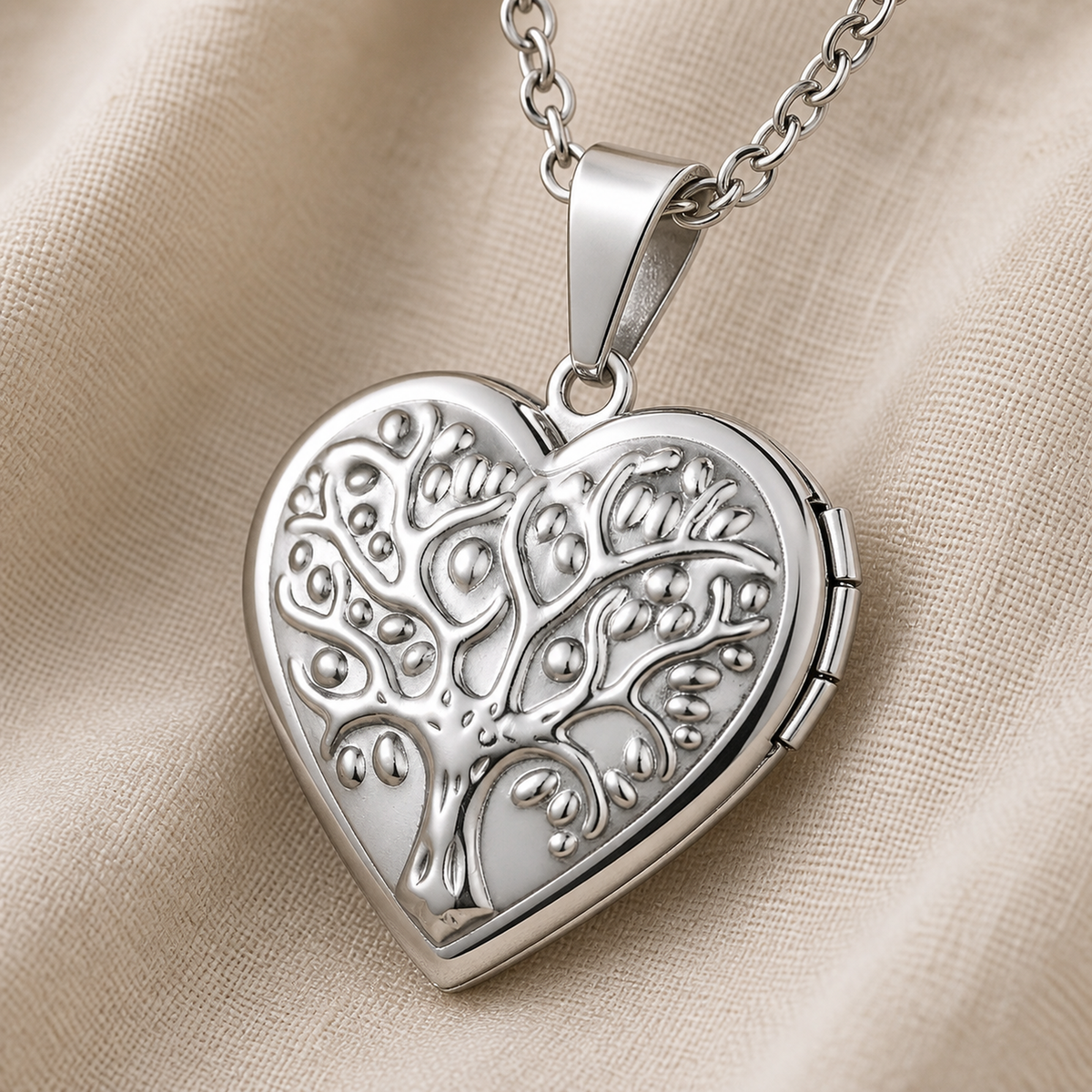 Detail of the heart locket side hinge, bail and oval-link chain