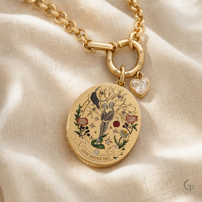 Gold-color Love Never Dies botanical skeleton medallion necklace on warm ivory linen