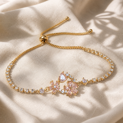 Pink floral crystal tennis bracelet with gold-color adjustable slider chain