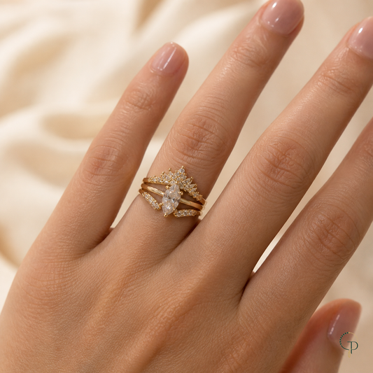 Complete three-piece marquise crown ring set worn together on an anonymous hand