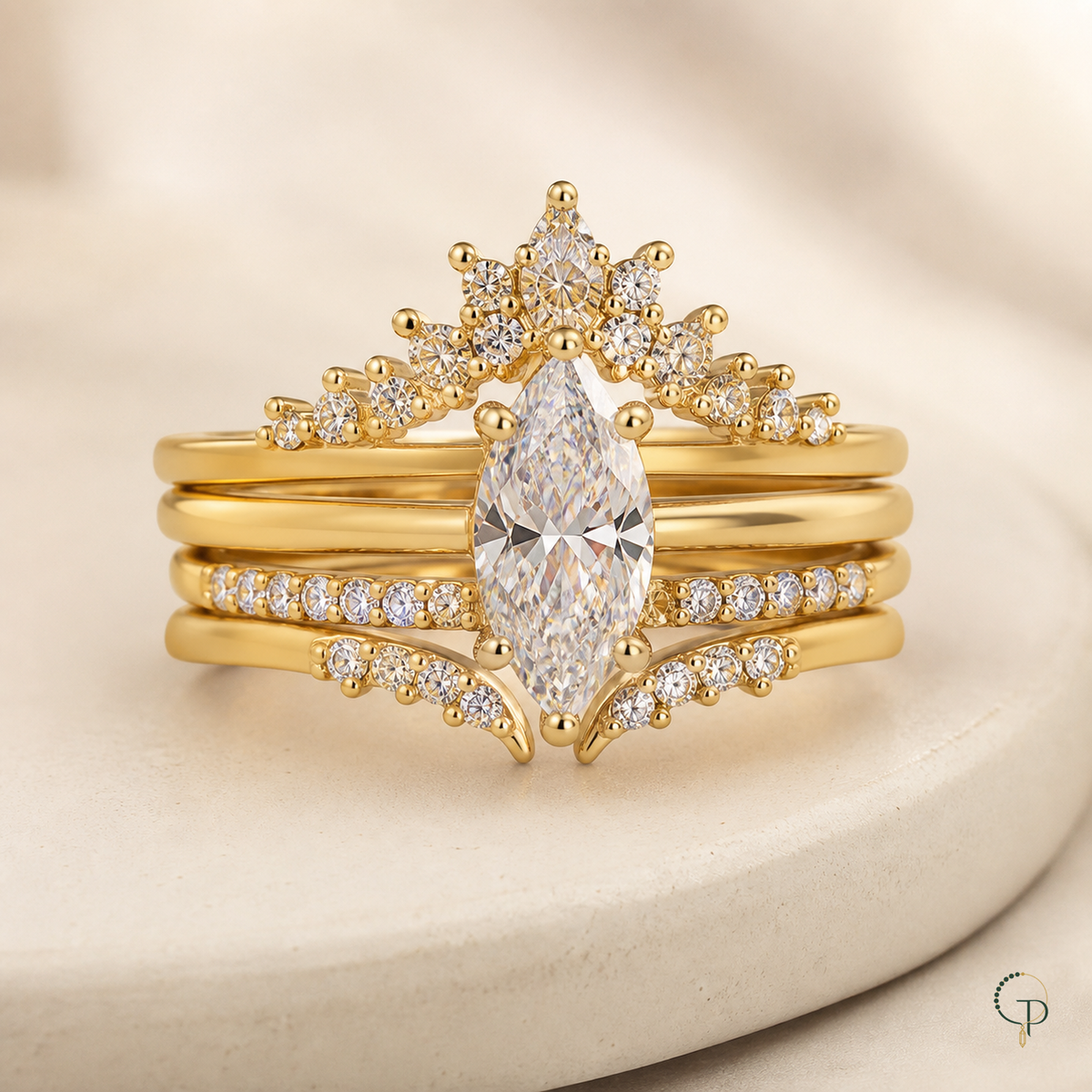 Close view of the assembled marquise solitaire, crown band and curved accent band