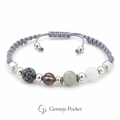 Mixed-bead gray braided cord bracelet on a white studio background
