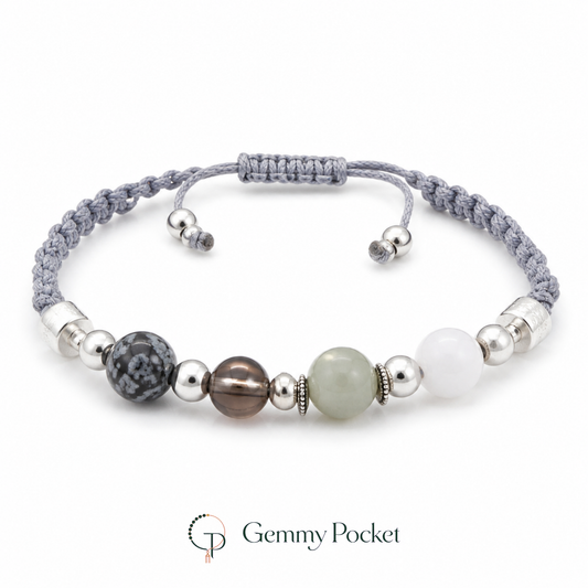 Mixed-bead gray braided cord bracelet on a white studio background