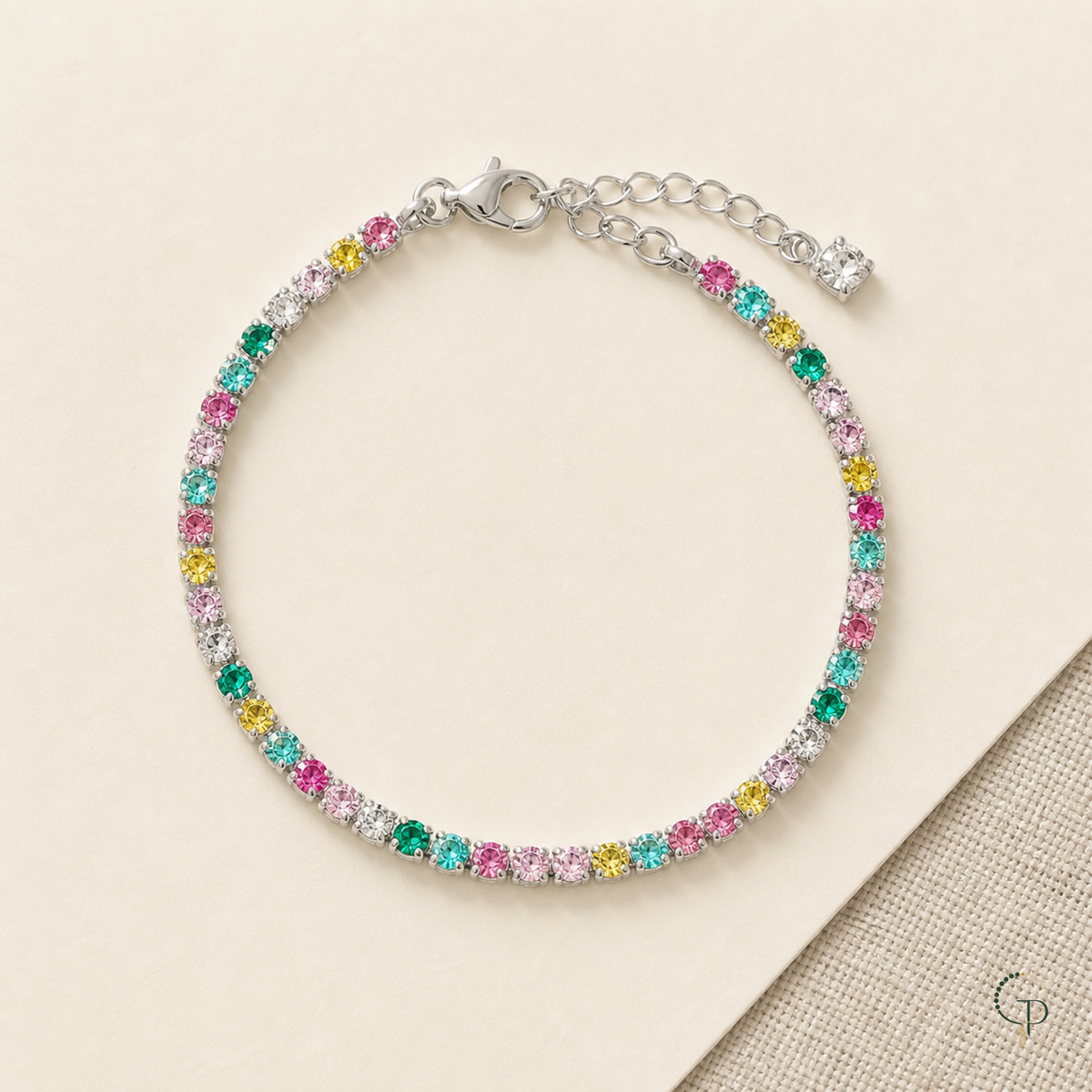 Full multicolor round-stone bracelet with clasp and extension chain laid flat