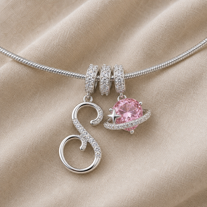 Detail of the silver-color snake chain and stone-set charm bails