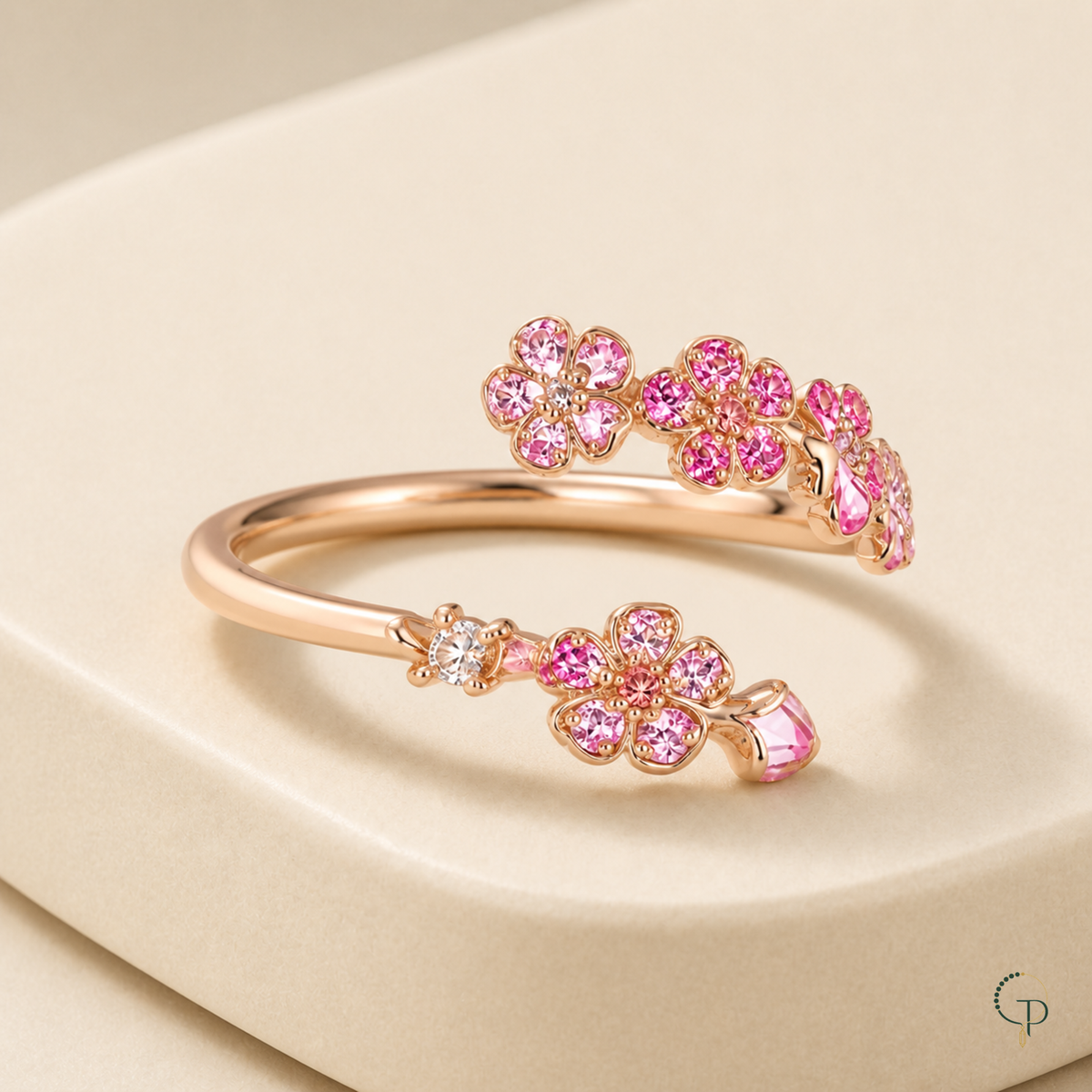 Three-quarter view showing the open band and raised pink floral branches