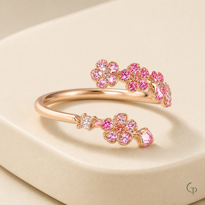 Three-quarter view showing the open band and raised pink floral branches
