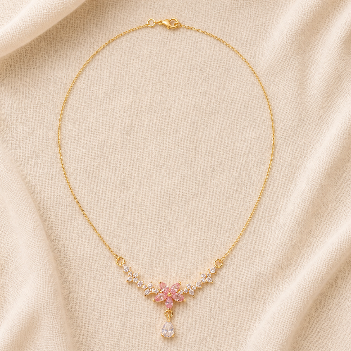 Full gold-color chain with pink floral and pear-shaped drop pendant