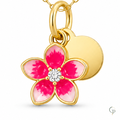 Macro view of the five pink petals, clear center, oval bail and round disc charm