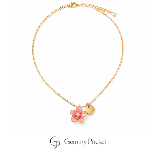 Pink five-petal blossom pendant necklace on a pure white studio background