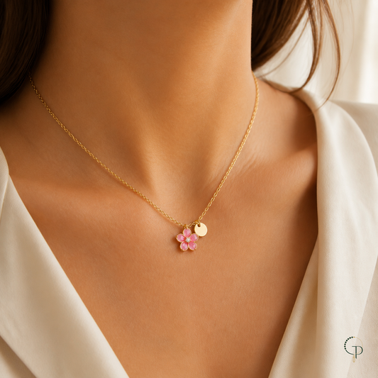 Gold-color pink blossom pendant necklace worn at the collarbone
