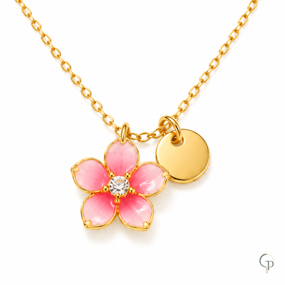 Close view of the pink flower pendant, bright center and round gold-color tag