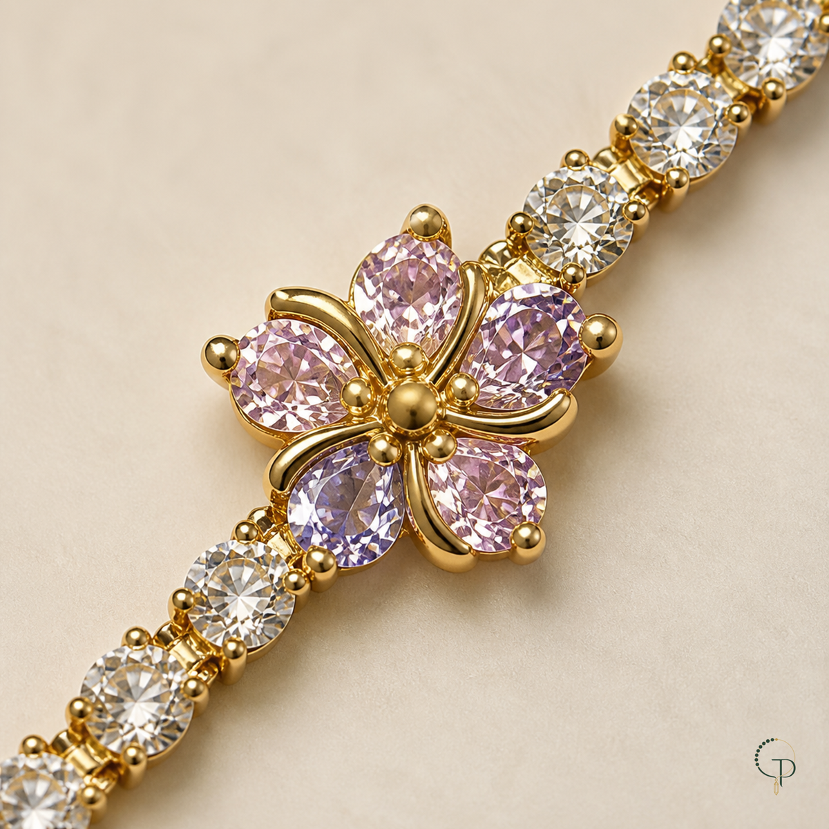 Close view of a pink five-petal blossom and clear round stone links