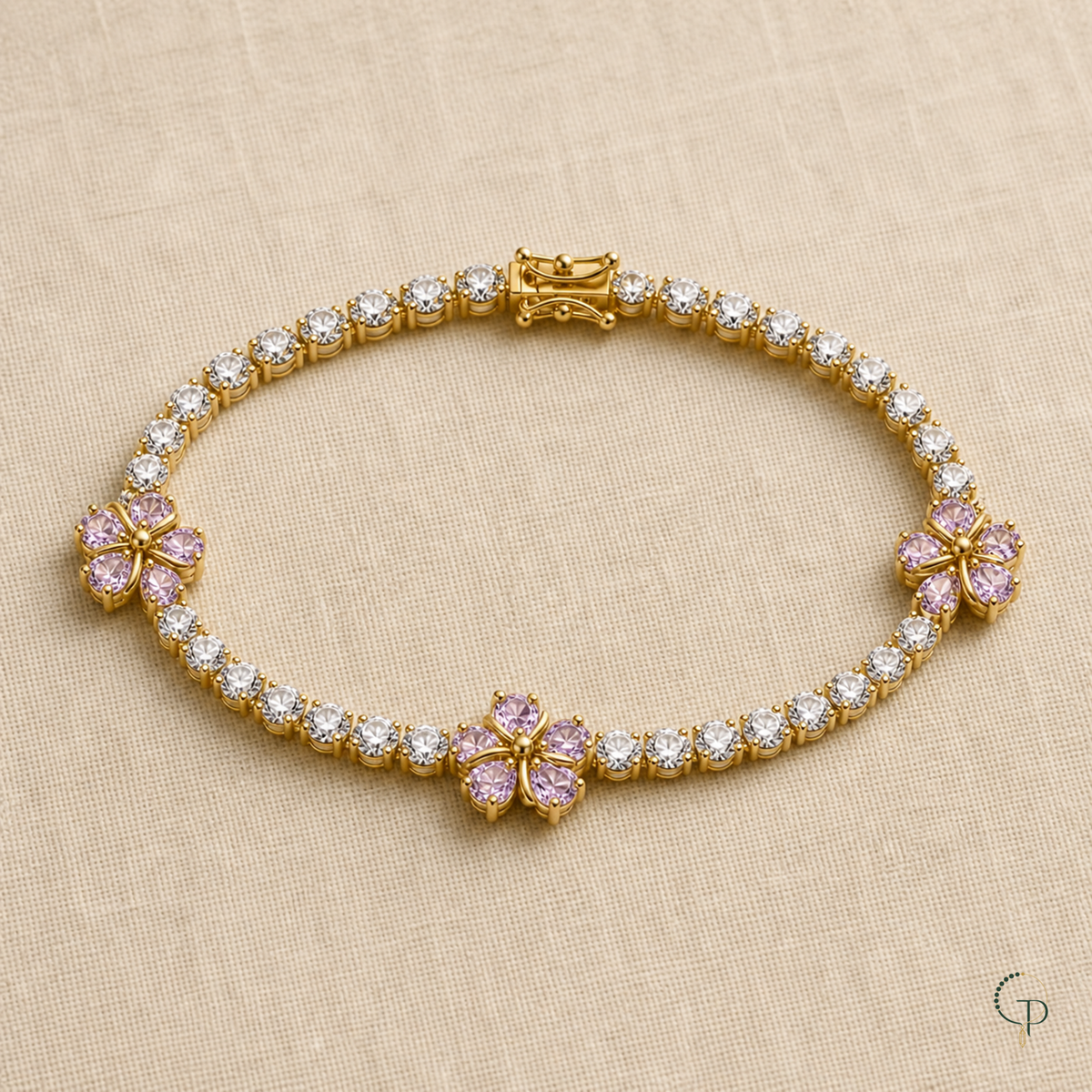 Full pink blossom tennis-style bracelet arranged on oatmeal linen