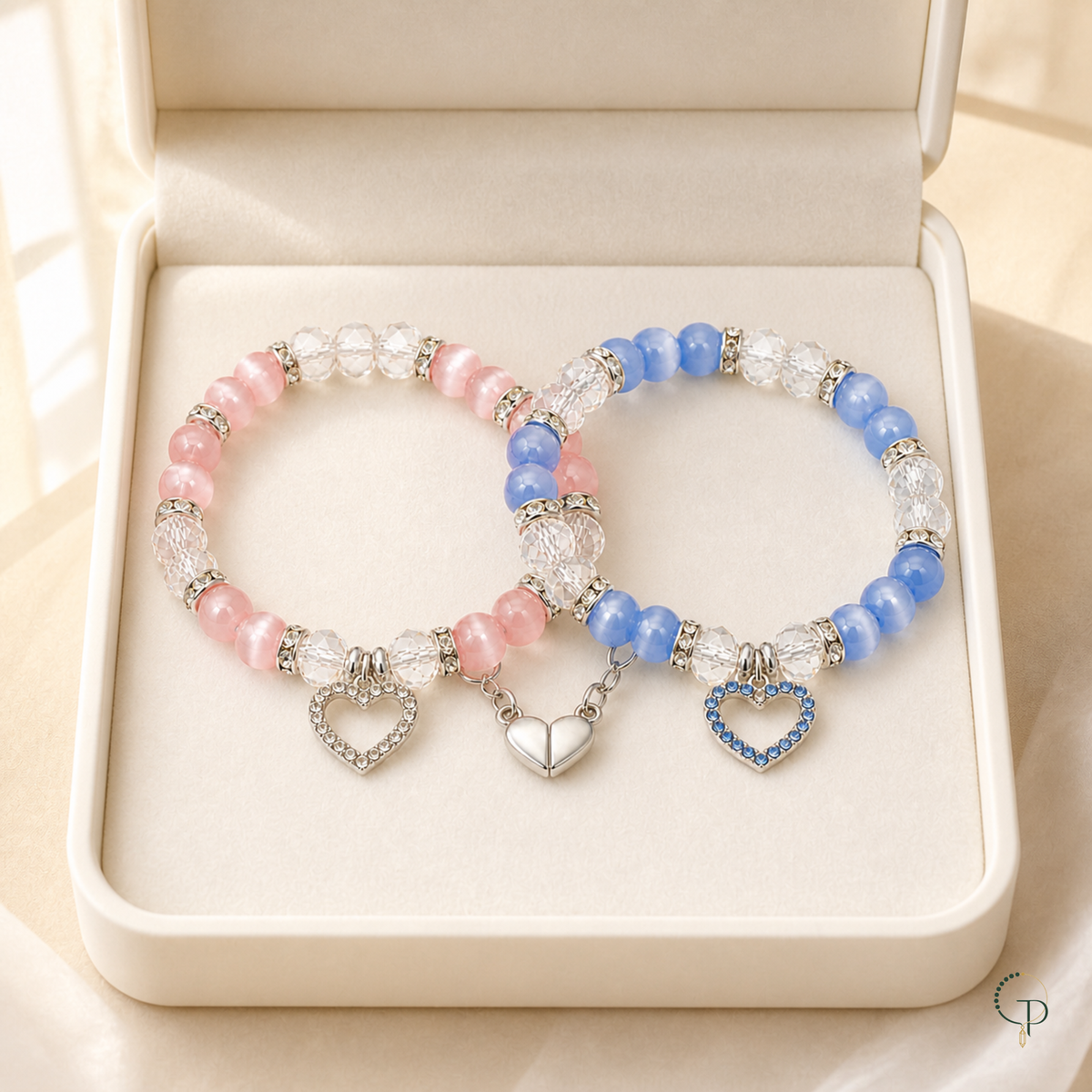 Pink and blue magnetic friendship bracelet set in an ivory gift box