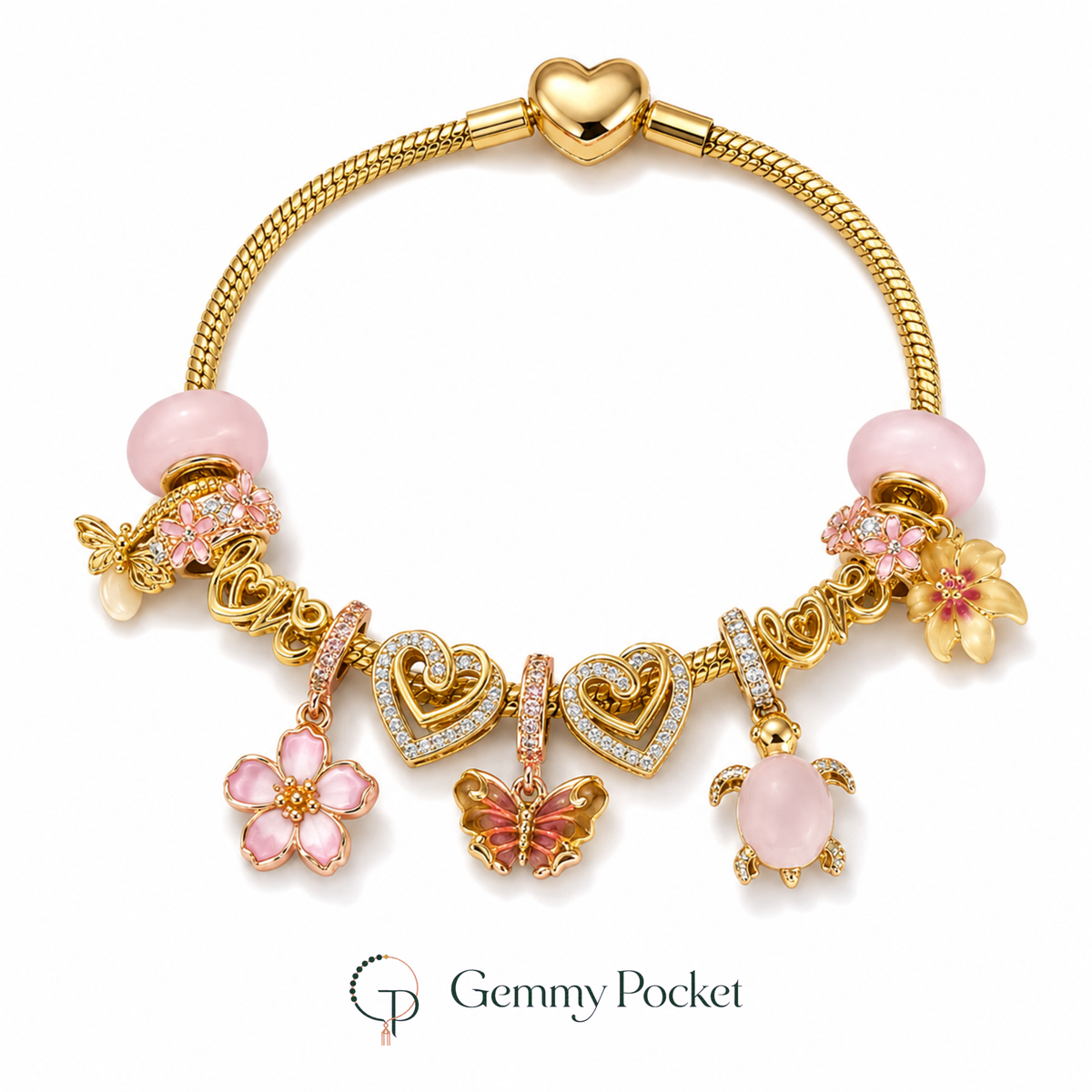 Gold-color charm bracelet with pink beads, flower, butterfly, turtle and double-heart details on white