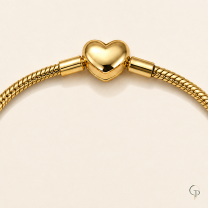 Heart-shaped gold-color clasp and adjoining snake-chain detail