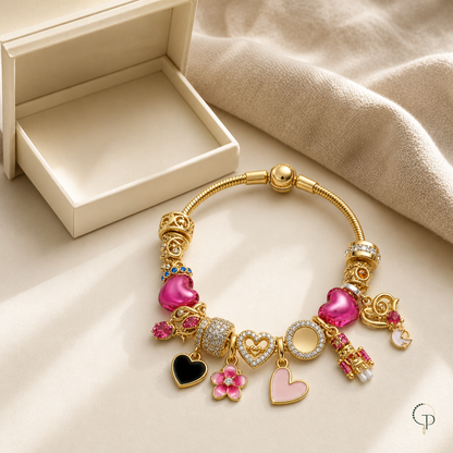 Pink heart and flower charm bracelet beside an unbranded ivory jewelry box